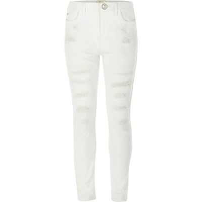 Girls white ripped skinny jeans